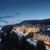 Fairmont Le Manoir Richelieu in La Malbaie, illuminated clifftop hotel overlooking snowy shoreline and bay