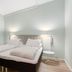 Aiden by Best Western Haugesund Airport guest room in Avaldsnes with twin beds and bedside lamps