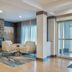 Fairfield Inn & Suites by Marriott Greenwood lobby seating area with stone fireplace and large windows