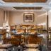 Vila Gale Porto restaurant with set tables and chairs in a bright dining room