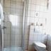 Gästehaus Klug bathroom in Sankt Stefan ob Stainz with glass shower and wall-mounted toilet