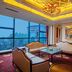 Grand Metropark Guofeng Hotel Tangshan lounge with chandeliers and city-view windows in Tangshan