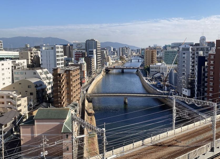 Hotel Third Place Hakata in Fukuoka with city canal and bridges view from an upper-floor room