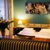 Mercure Grand Hotel Biedermeier Wien room in Vienna with striped sofa, bed, lamps and floral decor