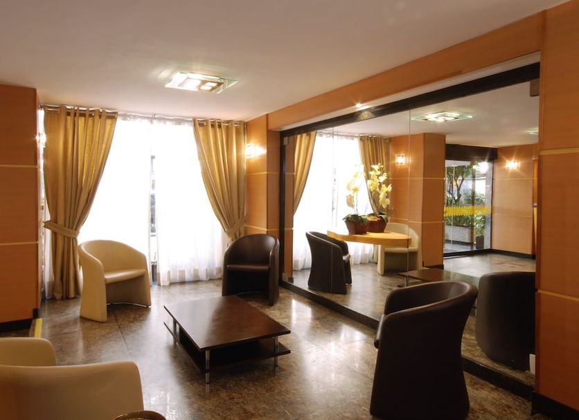 Hotel Vermont Ipanema lounge in Rio de Janeiro with seating, coffee table, and large windows
