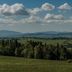 Dom Wypoczynkowy U Staszla in Bańska with rolling green hills, forests, and distant mountains