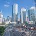 60 West Hotel in Hong Kong overlooking a busy city highway and modern skyscrapers