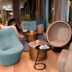 Motel One München-Olympia Gate lounge with modern egg chairs and city views in Munich