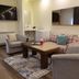 Chateau D'eau Hotel Faraya lounge with armchairs, sofa, coffee table and wall-mounted TV