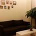 7 Days Inn Guangzhou Zoo Metro Station Branch lounge with black sofa, coffee table and potted plant
