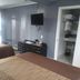 Essex Motel in Alturas guest room with two beds, wall-mounted TV, and open closet
