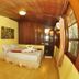 Baia Baia Resort, Ko Phi Phi: wood-paneled guest room with double bed, air conditioner, and wide window