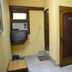 Yes Please Guest House in New Delhi: simple room with TV, AC, wooden door and tiled floor