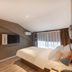Home Inn Suzhou Mudu Ancient Town Lingyanshan Metro Station room with bed, desk and wall-mounted TV in Suzhou