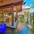 Hanalei Bay Resort in Princeville with open-air poolside lounge and waterfall-lined lagoon