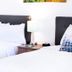 Blue Sage Inn & Suites Blanding guest room with two beds, white bedding, and a bedside lamp