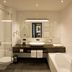 Van Der Valk Hotel Brugge Oostkamp bathroom with soaking tub, walk-in shower and modern vanity in Oostkamp