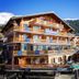 Hotel Bristol Verbier in Bagnes, chalet-style hotel with balconies and snowy mountain backdrop