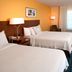 Fairfield Inn & Suites by Marriott Denver North/Westminster guest room with two beds and desk in Westminster