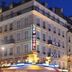 New Hôtel Gare Du Nord in Paris exterior at night with illuminated corner facade and hotel signs