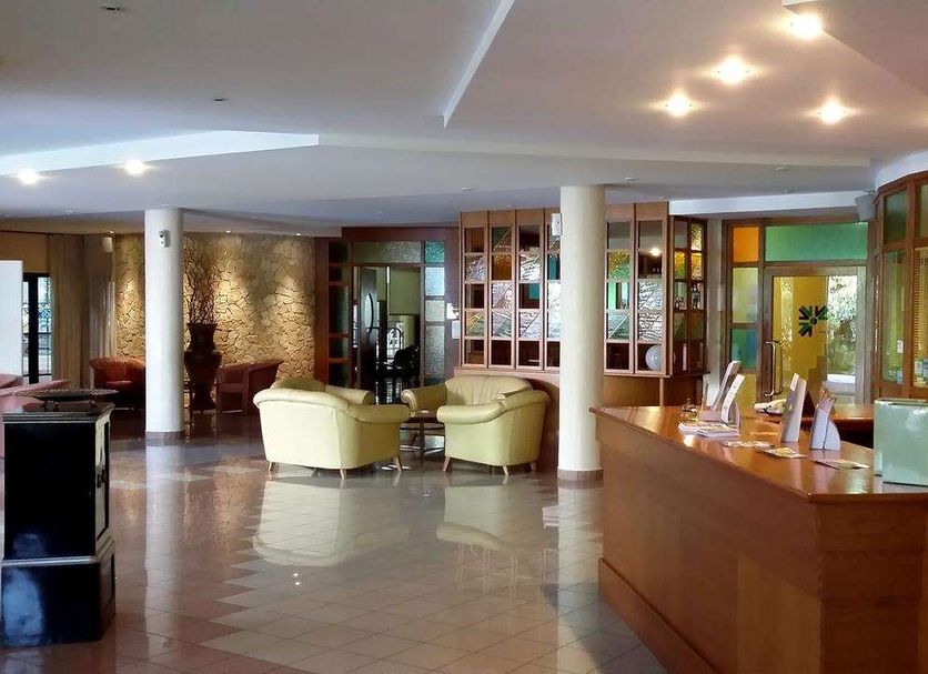 Tursport Hotel Residence Taranto lobby with seating area and reception desk