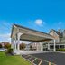 Red Roof Inn & Suites Knoxville East exterior with covered entry and parking lot in Knoxville