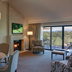 Silverado Resort Napa living room with fireplace, balcony, golf course view and seating area