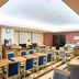 Chisun Hotel Koriyama breakfast room with tables, blue chairs, and buffet counters in Kōriyama