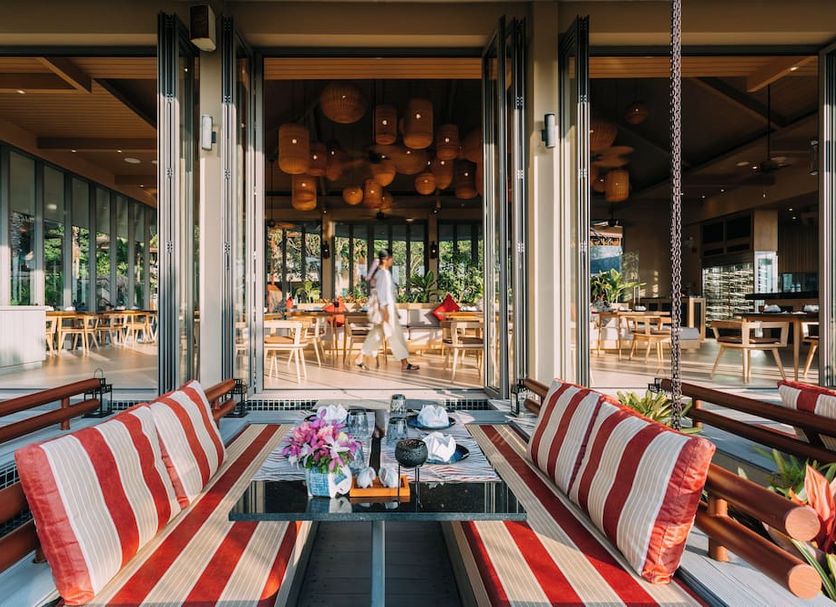 Mandarava Resort And Spa, Karon Beach terrace lounge with striped seating and open-air dining views