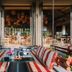 Mandarava Resort And Spa, Karon Beach terrace lounge with striped seating and open-air dining views