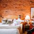 St. Eugene Golf Resort & Casino in Cranbrook guest room with exposed brick and sitting area