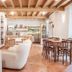 Alla Torre Del Barbarossa B&b Foresteria in Mandello del Lario: bright rustic lounge with dining table and kitchen