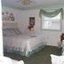 The Garden Walk Bed & Breakfast room in Lookout Mountain with a bed, window, and sitting chair
