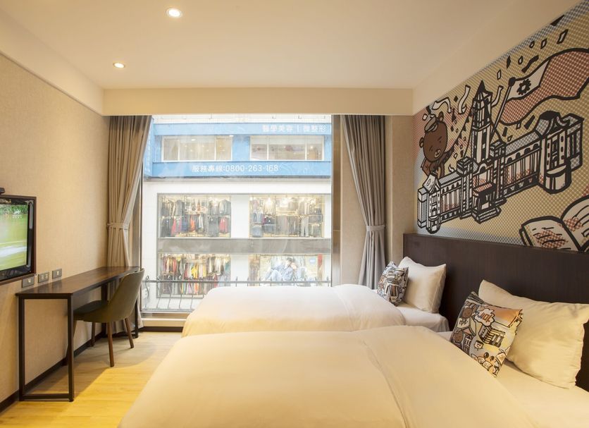 Just Live Inn-Taipei Station room with twin beds, large window, and city view in Taipei City