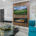 Candlewick Inn in Eureka Springs lounge with fireplace, wall-mounted TV and glass coffee table
