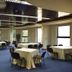 Hotel Miracorgo in Vila Real meeting room with round tables, chairs and large windows