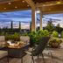 Home2 Suites by Hilton Idaho Falls outdoor patio with fire pit and seating at dusk