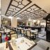 Pinnacle Lumpinee Park Hotel Bangkok dining room with tables, chairs and buffet station