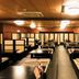 Livemax Resort Aki Miyajima in Hatsukaichi dining room with rows of low tables and benches