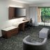 Courtyard by Marriott Tuscaloosa guest room with desk, balcony view, and seating area