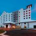 SpringHill Suites by Marriott Navarre Oceanfront exterior at dusk in Navarre with palm trees and entrance
