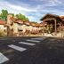 Cumberland Falls State Resort Park in Corbin with a rustic lodge entrance, stone facade, and landscaped grounds