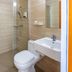 Haiweis Hotel (Shanghai Pudong Airport Store) bathroom with glass shower, toilet and sink in Shanghai