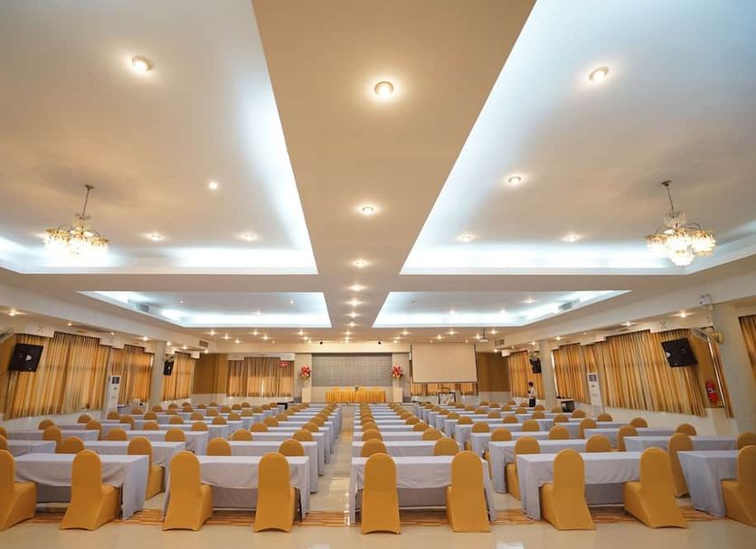 BCP Hotel Ban Chang conference hall with rows of covered banquet chairs and ceiling lights