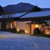 Gora Kadan in Hakone, exterior of a traditional inn with lit walkway and mountain backdrop