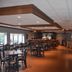 Quality Inn Perrysburg breakfast area with tables, chairs, and buffet counter