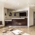 Studio 6 McAllen TX lobby with front desk, tiled floor, and seating area