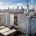 DoubleTree by Hilton Long Island City New York with Manhattan skyline and industrial chimneys in Queens