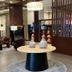 Best Western Plus Chihuahua Juventud lobby with lounge seating, round table decor and wood slat partition
