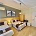 Ch Las Murallas in Madrid guest room with two single beds, wood floor, and wall-mounted TV